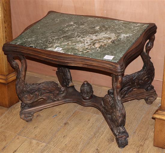 A carved oak marble top occasional table, on swan and dolphin supports, W.66cm D.48cm H.50cm